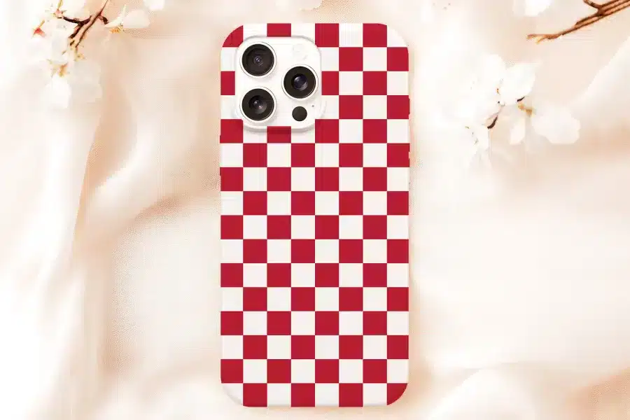 Iphone Case With A Red And White Checkered Pattern.