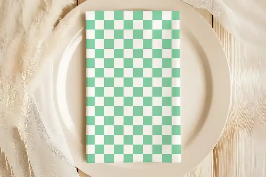 Mint Green And White Checkered Napkin On A Beige Plate.
