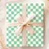 Gift Box With Light Green And White Checkered Pattern And A Beige Ribbon.
