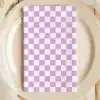 Lavender And White Checkered Napkin On A Beige Plate.