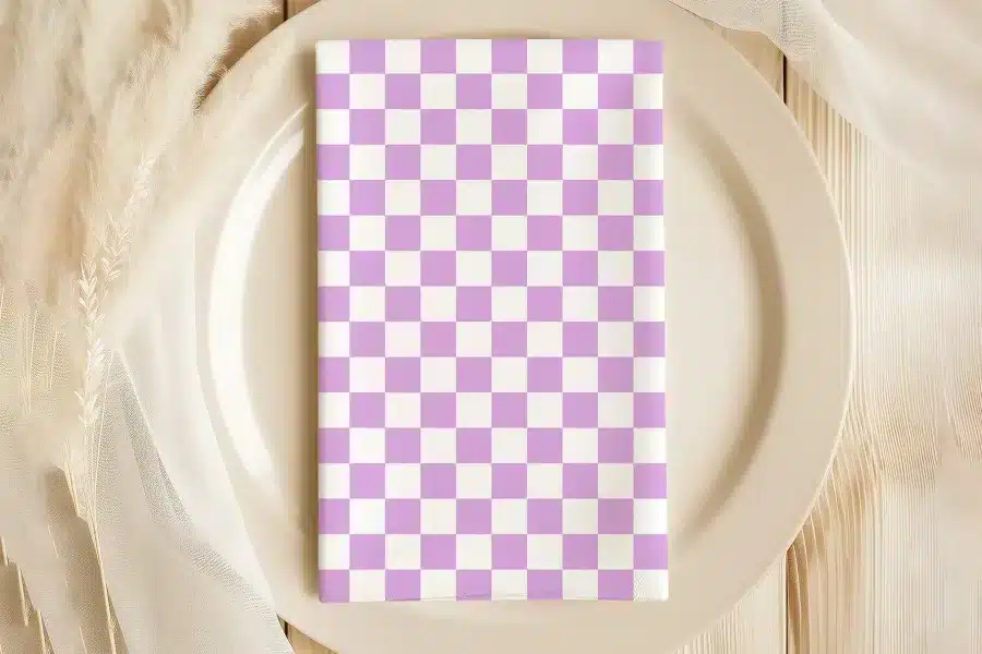 Lavender And White Checkered Napkin On A Beige Plate.
