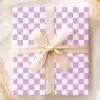 A Gift Box With A Lavender And White Checkered Pattern And A Beige Ribbon.