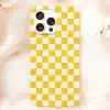 Phone Case With Yellow And White Checkered Pattern.