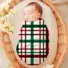 Sleeping Baby Swaddled In A Red, Green, And White Plaid Blanket.