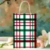 A Gift Bag With A Red, Green, And White Plaid Pattern.