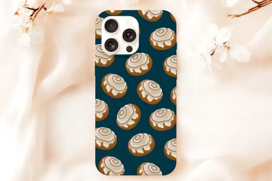 Phone Case With A Repeating Pattern Of Cinnamon Rolls On A Dark Teal Background.