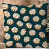 Teal Square Pillow With A Repeating Pattern Of Cinnamon Rolls.