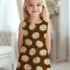 Girl In A Brown Dress Covered In A Pattern Of Cinnamon Rolls.