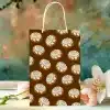 Paper Gift Bag With A Repeating Pattern Of Cinnamon Rolls.