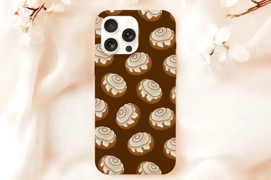 Phone Case With A Pattern Of Cinnamon Rolls On A Brown Background.