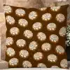 Brown Square Pillow With A Repeating Pattern Of Cinnamon Rolls.