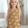 Girl In A Sleeveless Cinnamon Roll Print Dress.