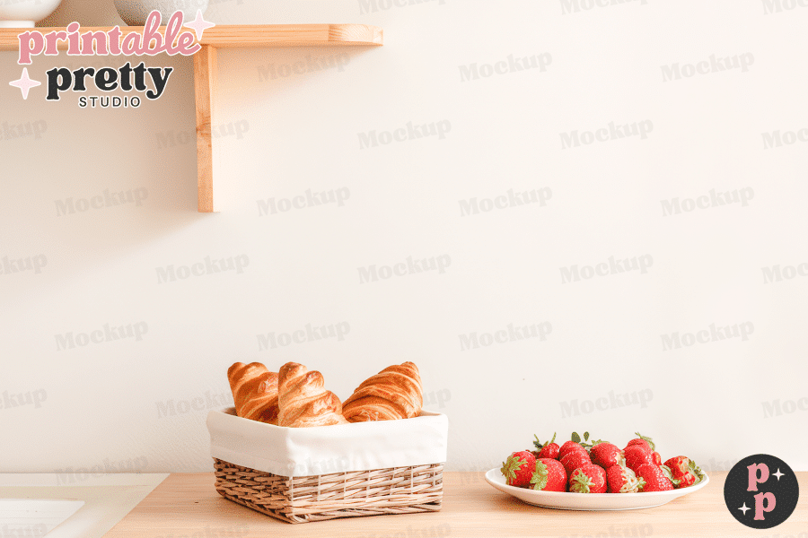 A Wicker Basket Of Croissants Sits On A Wooden Table Next To A Plate Of Strawberries.
