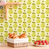 Kitchen Counter With A Pear Patterned Backsplash, A Basket Of Croissants, And A Bowl Of Strawberries.