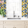 Kitchen Sink And Countertop With Lemon-Patterned Wallpaper.