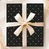 Black Gift Box With White Polka Dots And A Beige Ribbon.