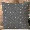Dark Gray Square Pillow With A White Polka Dot Pattern.