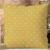 Mustard Yellow Square Pillow With A White Polka Dot Pattern.