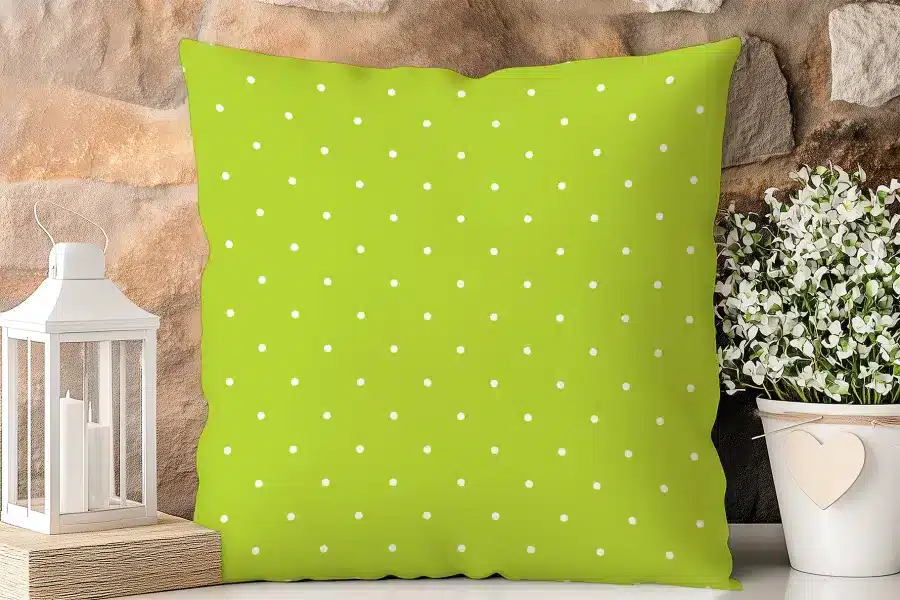 Lime Green Pillow With White Polka Dots.