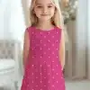 Girl Wearing A Pink Polka Dot Dress.