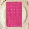 Pink Napkin With White Polka Dots On A White Plate.