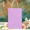 Lavender Gift Bag With White Polka Dots, Near Pink Flowers.