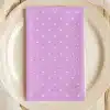 Lavender Napkin With White Polka Dots On A Beige Plate.