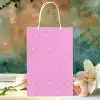 Pink Polka Dot Gift Bag With White Handles.