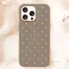 A Taupe Phone Case With White Polka Dots.