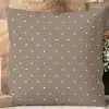 Brown Square Pillow With A White Polka Dot Pattern.