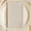 Beige Dinner Plate With A Light Beige Polka Dot Napkin.