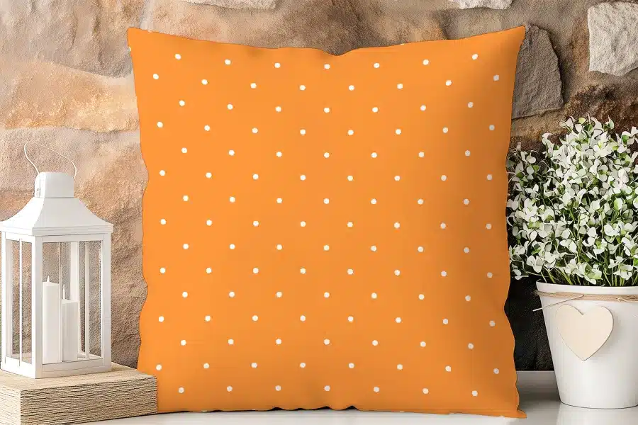 Orange Pillow With White Polka Dots.