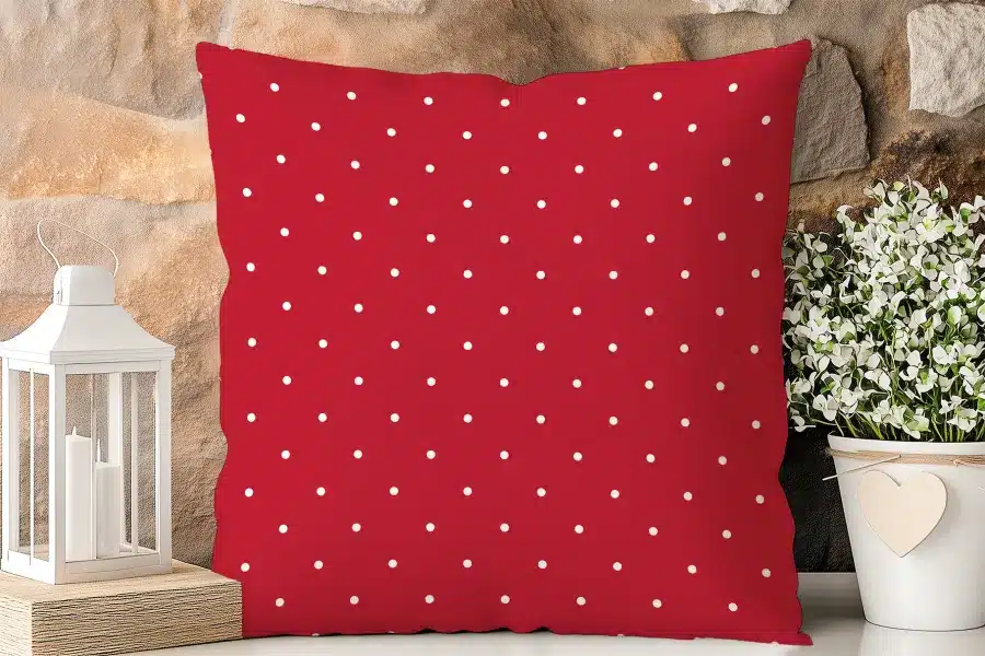 Red Square Pillow With White Polka Dots.