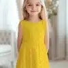 Young Girl Wearing A Yellow Polka Dot Dress.