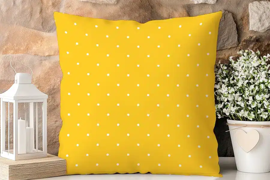 Yellow Square Pillow With White Polka Dots.