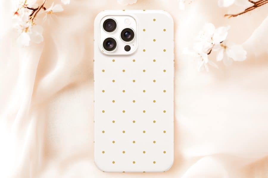 White Phone Case With Gold Polka Dots.