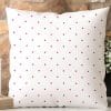 White Pillow With A Pink Polka Dot Pattern.