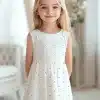 Girl In A White Dress With Light Purple Polka Dots.