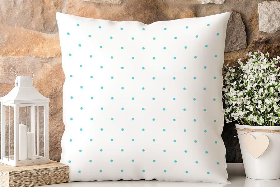 White Pillow With Teal Polka Dots.