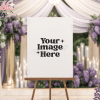 Blank Sign On Easel In Wedding Setting With Purple Flowers.