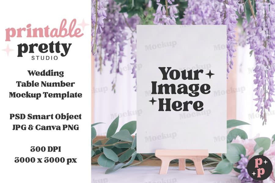 Blank Wedding Table Number Mockup Template On A Small Easel, Surrounded By Flowers.