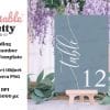 A Blue Wedding Table Number Card On A Small Wooden Easel.