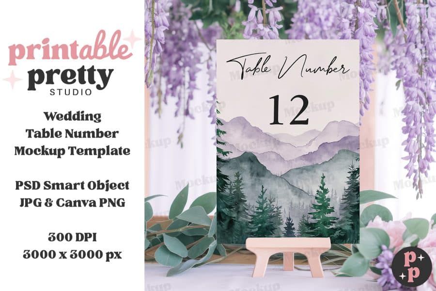 Wedding Table Number Card Mockup Featuring A Watercolor Landscape Of Mountains And Trees.