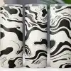 Three Tumblers With A Black And White Marbled Design.