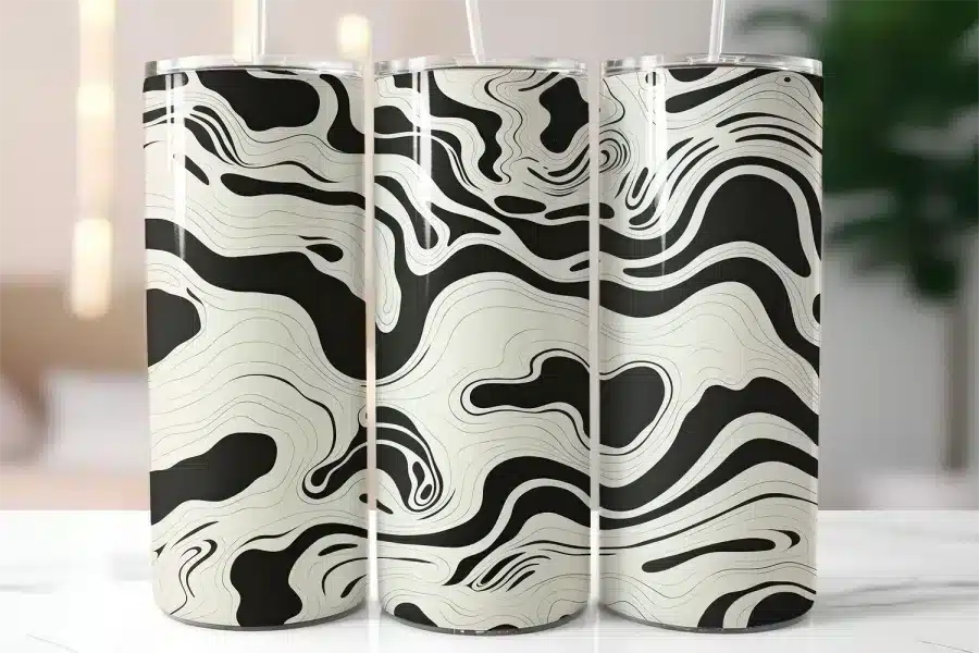 Three Tall Tumblers With Black And Off-White Swirling Designs.