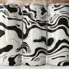 Three Black And Off-White Swirled Tumblers.