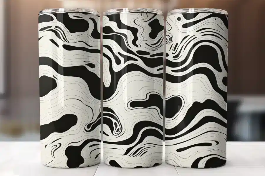 Three Black And Off-White Swirled Tumblers.