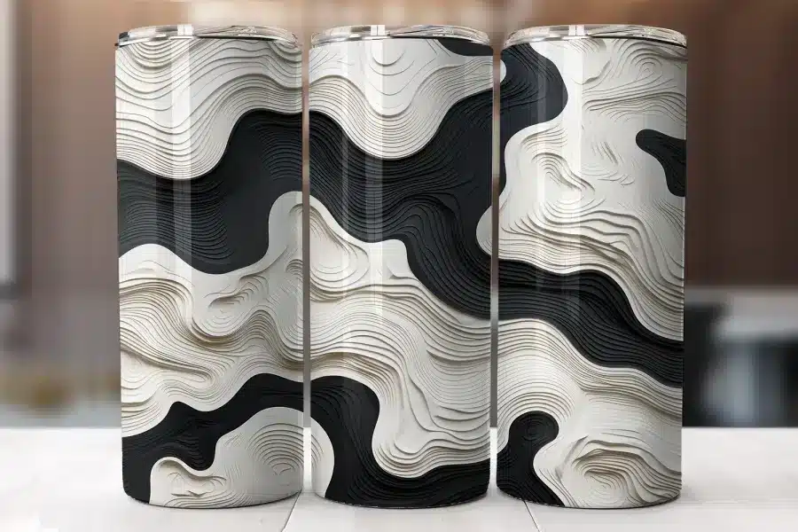 Three Tall Tumblers With A Black And White Topographic Pattern.