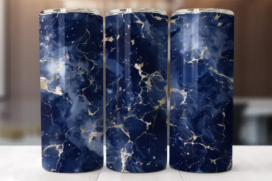 Three Navy Blue And Gold Marble Patterned Tumblers.
