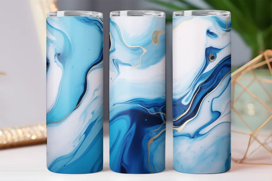 Three blue and gold marble patterned tumblers.